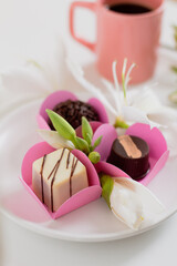 Candies on white background. Spring feminine composition. Food styling.