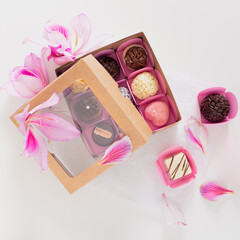 Candies on white background. Spring feminine composition. Food styling.