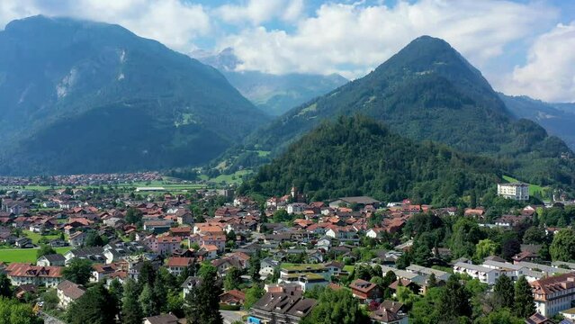 Aerial view over the city of Interlaken in Switzerland. Beautiful view of Interlaken town, Eiger, Monch and Jungfrau mountains and of Lake Thun and Brienz. Interlaken, Bernese Oberland, Switzerland.