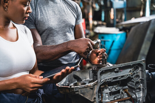 Professional mechanic checking and repair the engine.