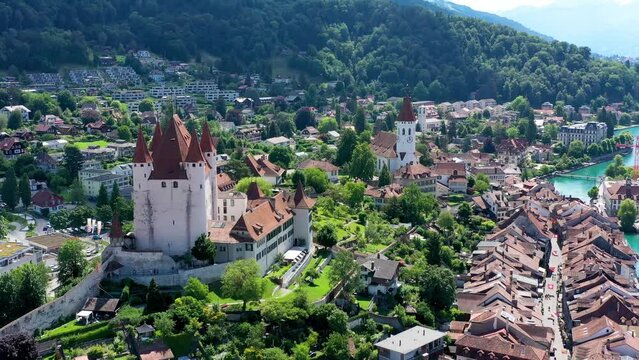 Panorama of Thun city with Alps and Thunersee lake, Switzerland. Historical Thun city and lake Thun with Bernese Highlands swiss Alps mountains in background, Canton Bern, Switzerland.