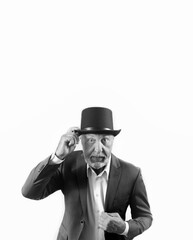 Imposing elderly man in a suit and a top hat. black and white. copy space. vertical