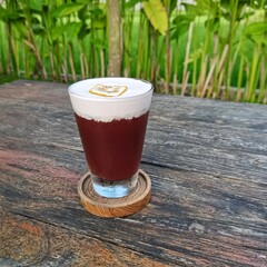 Bartender Cocktail with dried orange fruit, lemons and sparkling soda. Refreshing drink in the afternoon sunlight.