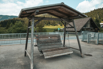 Fototapeta na wymiar Large wooden swing in the park.