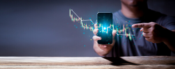 Stock market investments using tablets to analyze trading data. smartphone with stock exchange...