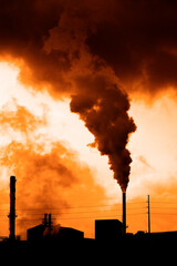 Pollution and smoke from chimneys of factory or power plant environment dirty