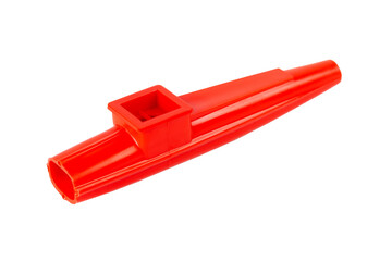 Red kazoo, plastic traditional musical instrument object isolated on white, cut out, closeup. Kids...