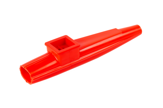 Red kazoo, plastic traditional musical instrument object isolated on white, cut out, closeup. Kids wind instruments with vibrating membrane, unique membranophones, noisemakers simple concept, nobody