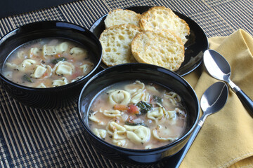 Tuscan chicken tortellini soup served with toasted English muffins