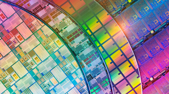 Silicon Wafers with microchips used in electronics for the fabrication of integrated circuits