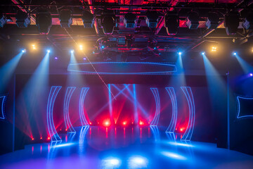 Checkered scene with laser beams, lamps and swirling smoke, disco dancing area interior