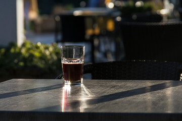 a glass on a table outsite