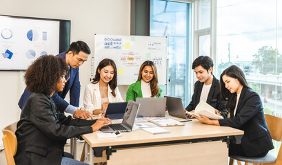 Mix race young start up business people meeting at office desk in modern workplace.