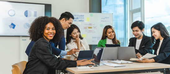 Mix race young start up business people meeting at office desk in modern workplace.