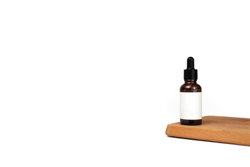 blank packaging template for brown glass dropper bottle cosmetic care products with wooden stage board in front of white background banner
