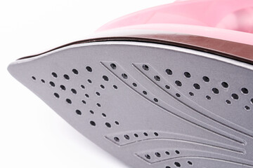 Ironing iron surface isolated on white background closeup