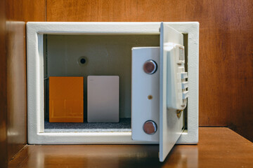 Fototapeta premium Security external hard drive in open metal safe. External hard disk containing confidential and important information keep well in white safe box. Confidentiality and Importance of Information Concept