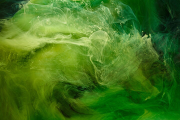 Liquid fluid art abstract background. Green dancing acrylic paints underwater, cosmic smoke ocean © amixstudio