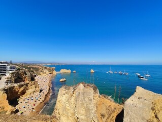 Praia Dona Ana beach with turquoise sea water and cliffs, Portugal. Beautiful Dona Ana Beach (Praia Dona Ana) in Lagos, Algarve, Portugal.