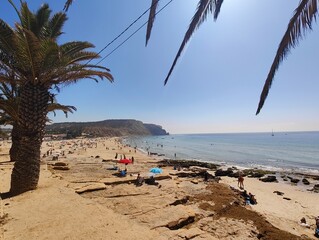 Waterfront of Praia da Luz in the Algarve. In the background the rocky coast with beach
