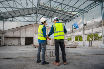 Civil engineer inspect structure at construction site against blueprint, Building inspector join inspect building structure with civil engineer. Civil engineer hold blueprint inspect building