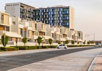 Dubai, UAE - 08.16.2022 - Close up shot of a modern townhouses in Dubai South district. City