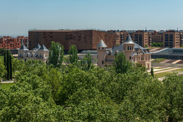 Fototapeta na wymiar View of a park, some castles and modern residential buildings in the city of Alcorcón, Madrid