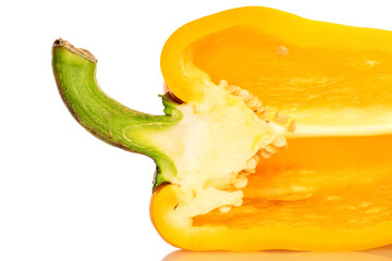 Fototapeta na wymiar One half of bright yellow, organic ripe juicy bell pepper, close-up, on a white background.