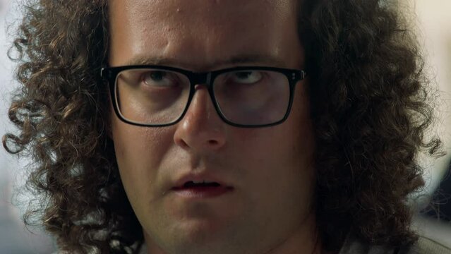 CRASH ZOOM IN Nerdy Caucasian employee is frustrated after recieving extra work on Friday evening