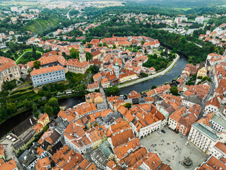 Fototapeta na wymiar Czechia. Cesky Krumlov. A beautiful and colorful historical Czech town. The city is UNESCO World Heritage Site on Vltava river. Aerial view from drone. Czech, Krumlov. Europe. 