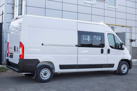 Russia, Izhevsk - August 20, 2021: Fiat showroom. New modern Ducato van in dealer showroom. Back and side view. Famous world brand.