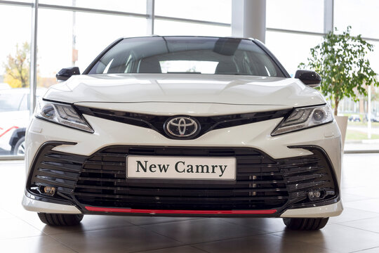 Russia, Izhevsk - September 30, 2021: Toyota Showroom. New Bussines Class Toyota Camry Car In Dealer Showroom. Front View. Famous World Brand.