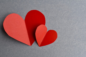 Two handmade paper hearts with copy space