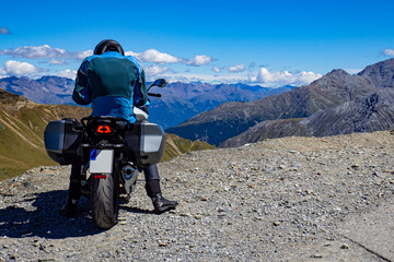 Motorcyclist in the alps in summer
