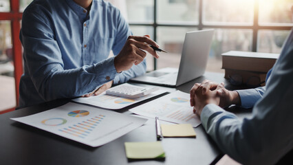 The business team jointly plan the investment at the meeting. Close-up of business advisor pointing...