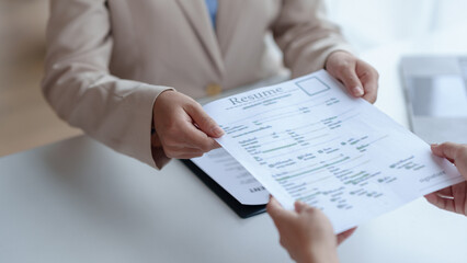 New graduate women fill out the human resources department application form review and prepare your personal document, academic history, and interview detail.