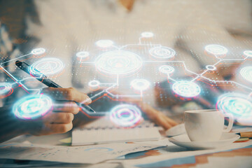 Double exposure of social network theme drawing over people taking notes background. Concept of...