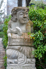 statue of a person in a garden