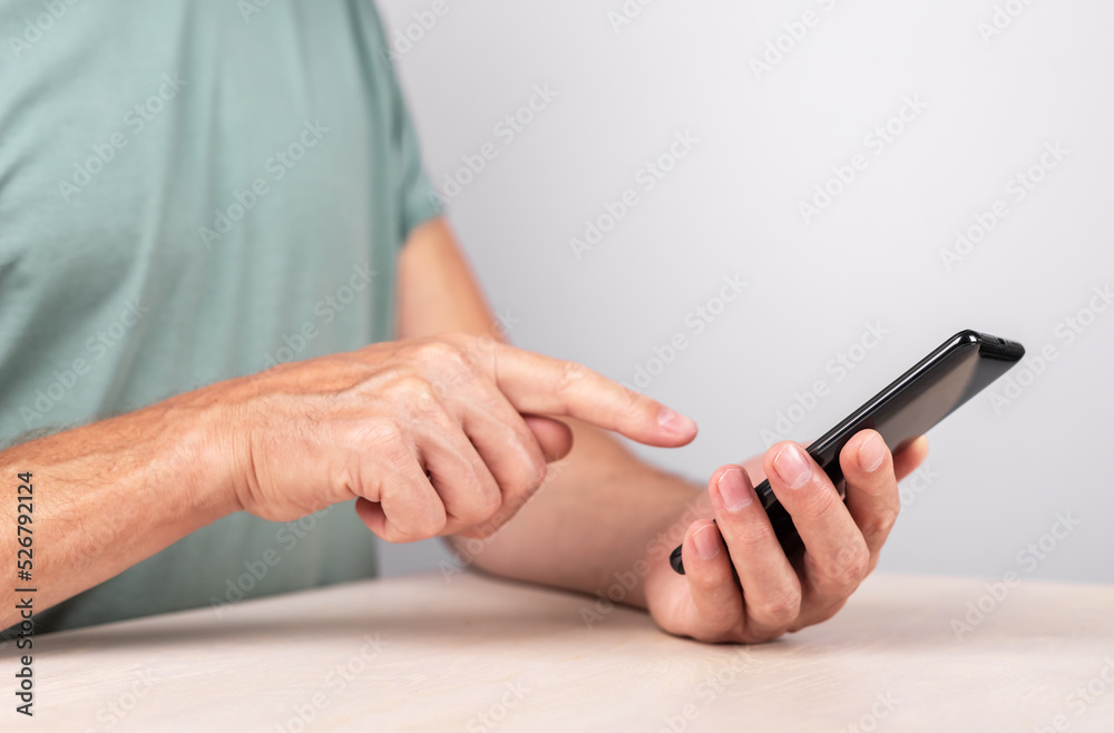 Poster man forefinger clicking ok button at phone. male using smartphone for sending e-mail, checking bank 