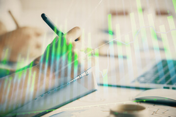 Double exposure of forex graph drawing over people taking notes background. Concept of financial analysis