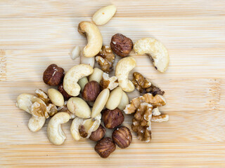 flat lay view mixed nuts on a environmentally friendly bamboo platter  dish