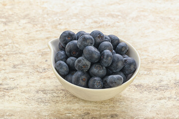 Sweet ripe blueberry heap in the bowl