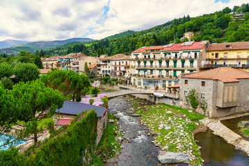 Fototapeta na wymiar Houses next to the river Ter in the mountains of the province of Gerona in the city of Camprodon, Catalonia.