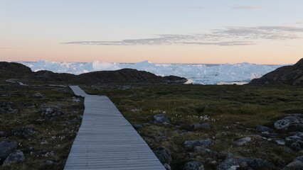 Walk to Sermermiut icebergs in Ilulissat Greenland in the evening