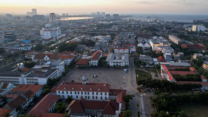 Aerial View. Fatahilah museum at Old City at Jakarta, Indonesia. With Jakarta cityscape and noise cloud when sunset.