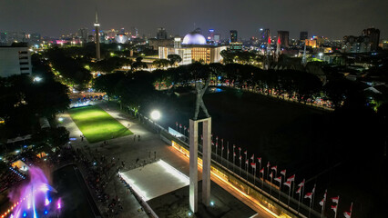 Fototapeta na wymiar Aerial view of West Irian Liberation monument in downtown Jakarta with Jakarta cityscape.