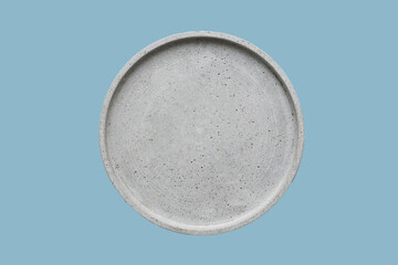 Concrete plate mock up, round dish on a blue background, concrete home decor, template for product placement, top view