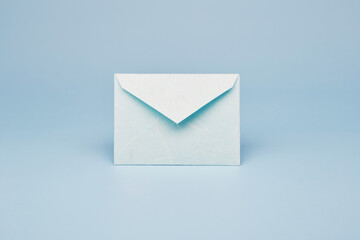 Bright blue color paper office envelope for greeting or invitation with copy space isolated on the...