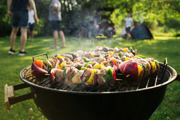Shashlik barbecue. Wooden sticks with vegetable and meat. Chicken, pork, onion and bell pepper...