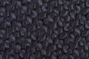 Black Knitted fabric background or texture